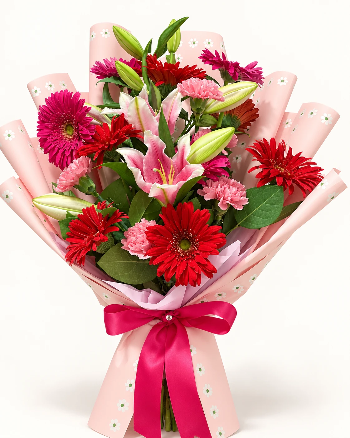 Ramo de lirios rosados, gerberas rojas y fucsias y claveles rosados con envoltura rosa y moño fucsia